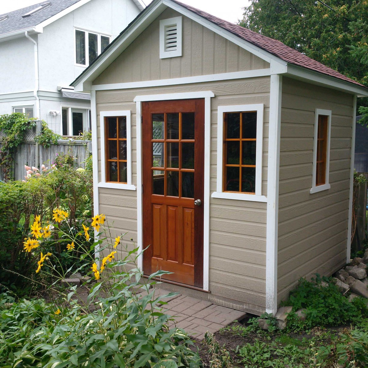 Canexel Palmerstone Shed design 8' x 8' in the backyard with a windows on the side. ID number  5722