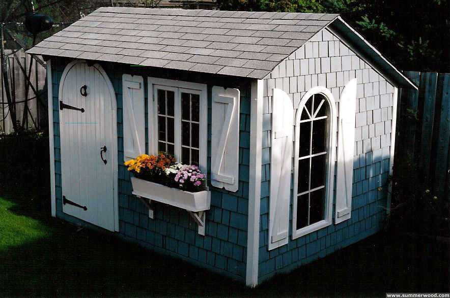Bar harbor shed design 8 x 10 in a yard with pane arch seen from the right. ID number 1499