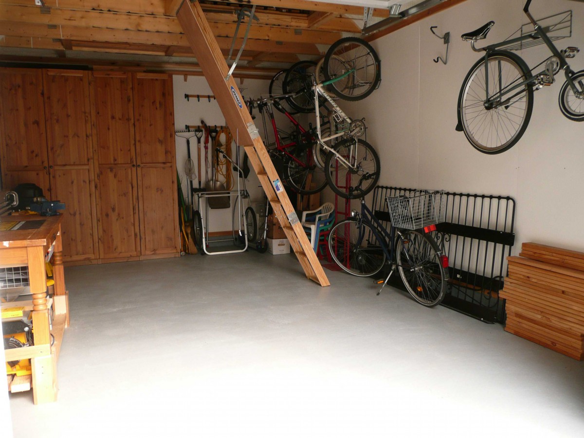 Highland DIY garage plan 14  x  20 in backyard with metal doors seen from inside.ID number 3361-3.