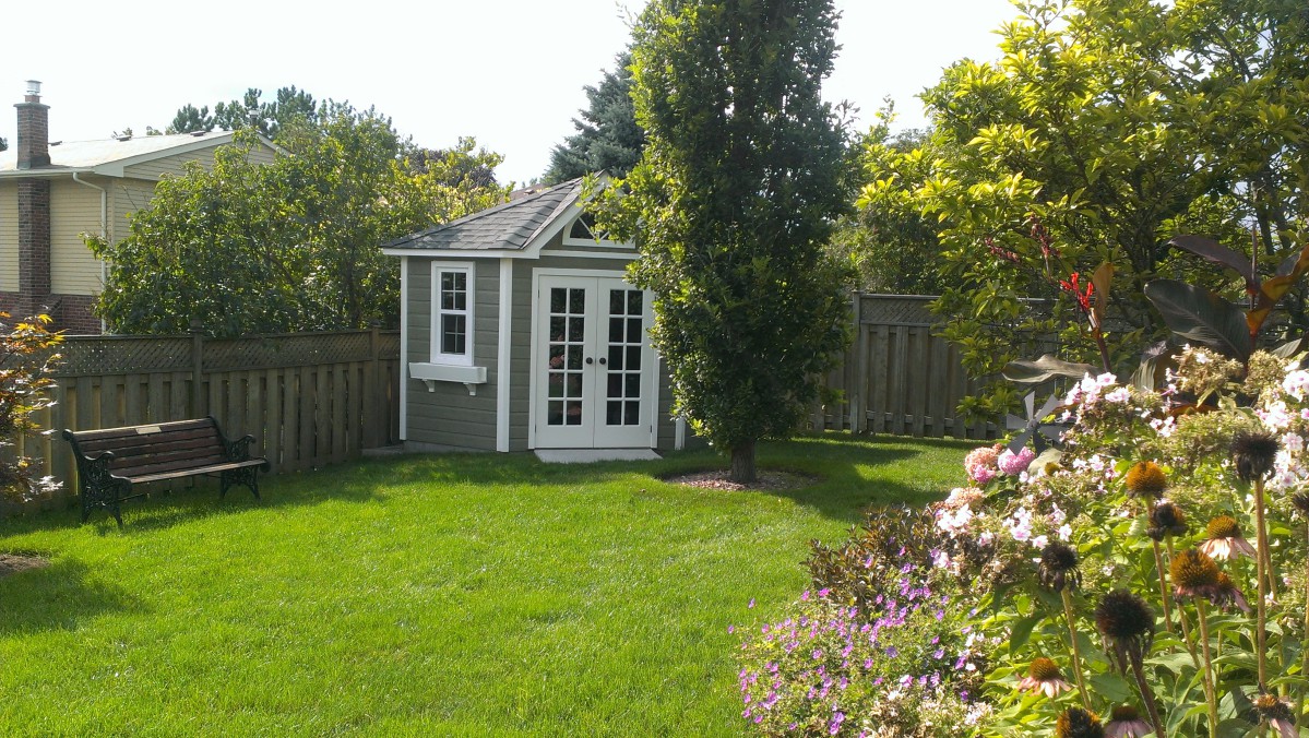 catalina home studio 9ft with french double doors in a garden seen from the front2. ID number 5588