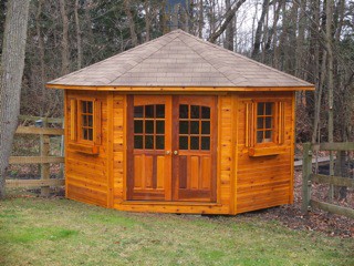catalina shed design 11ft with double doors in a backyard seen from the front. ID number 1803-1.
