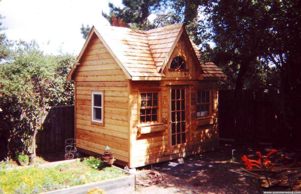 Copper creek shed design 10 x 12 in a backyard with a French door seen from the left side. ID number 1909-3