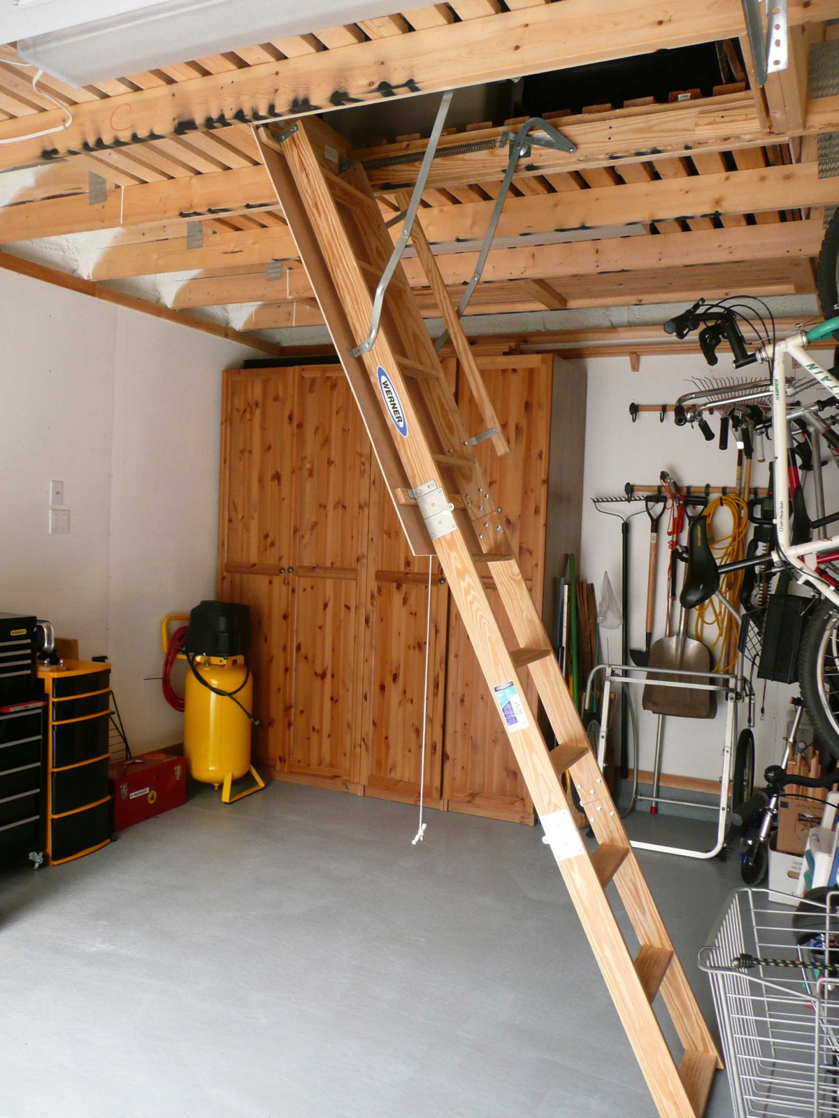 Highland DIY garage plan 14  x  20 in backyard with metal doors seen from inside.ID number 3361-5.