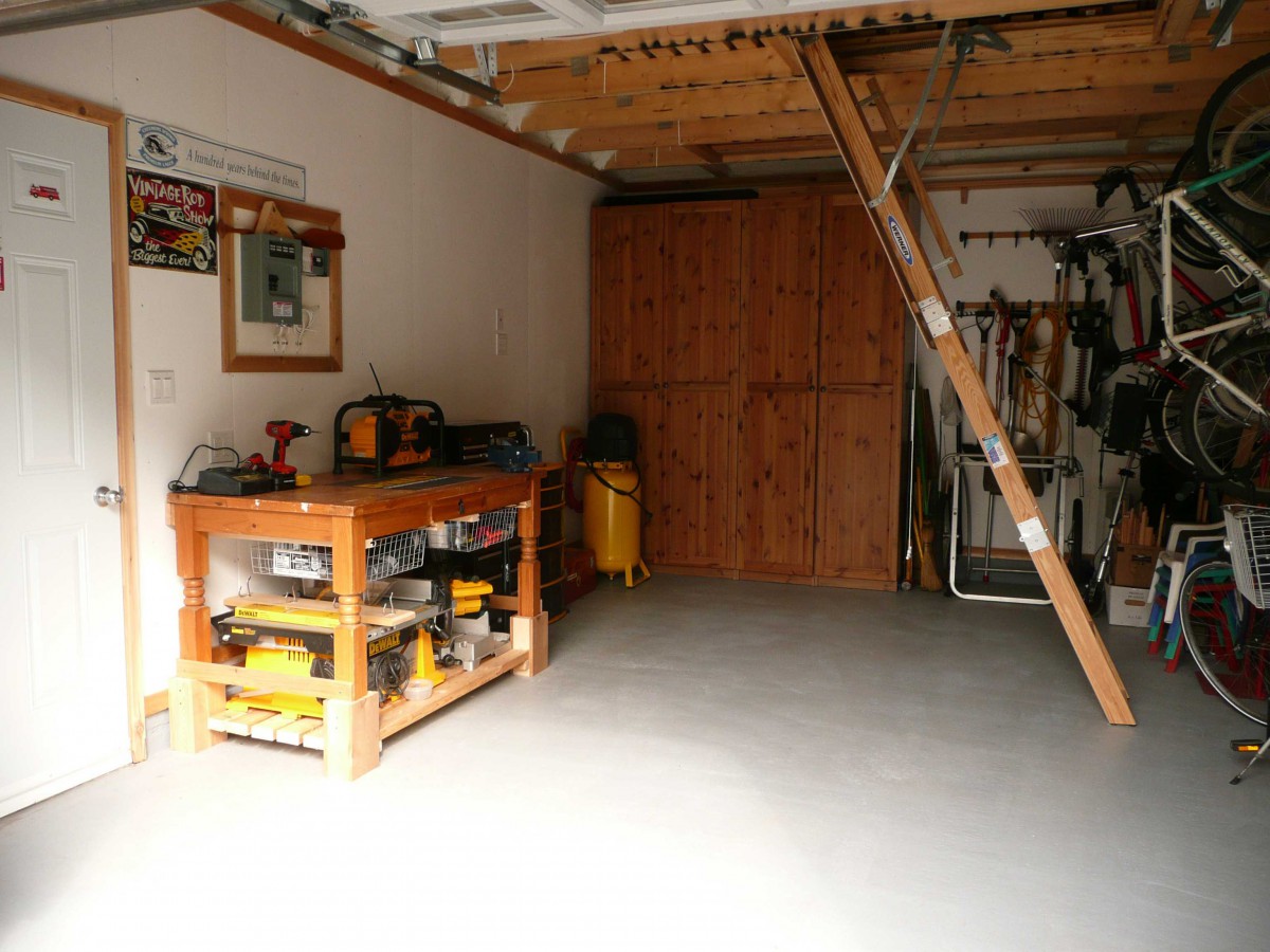 Highland DIY garage plan 14  x  20 in backyard with metal doors seen from inside.ID number 3361-4.