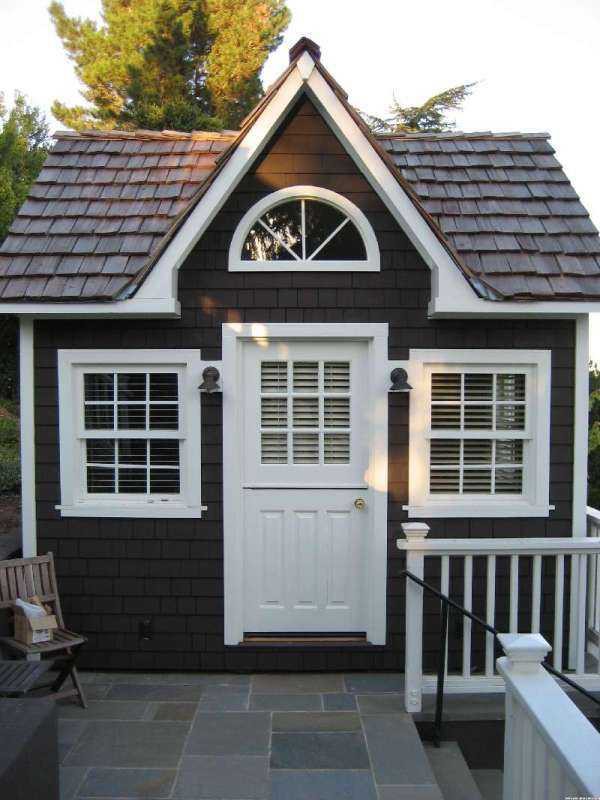 Cedar Cooper Creek home studio design 11ft with fan arch window in a yard as seen from the front. ID number 3036-122