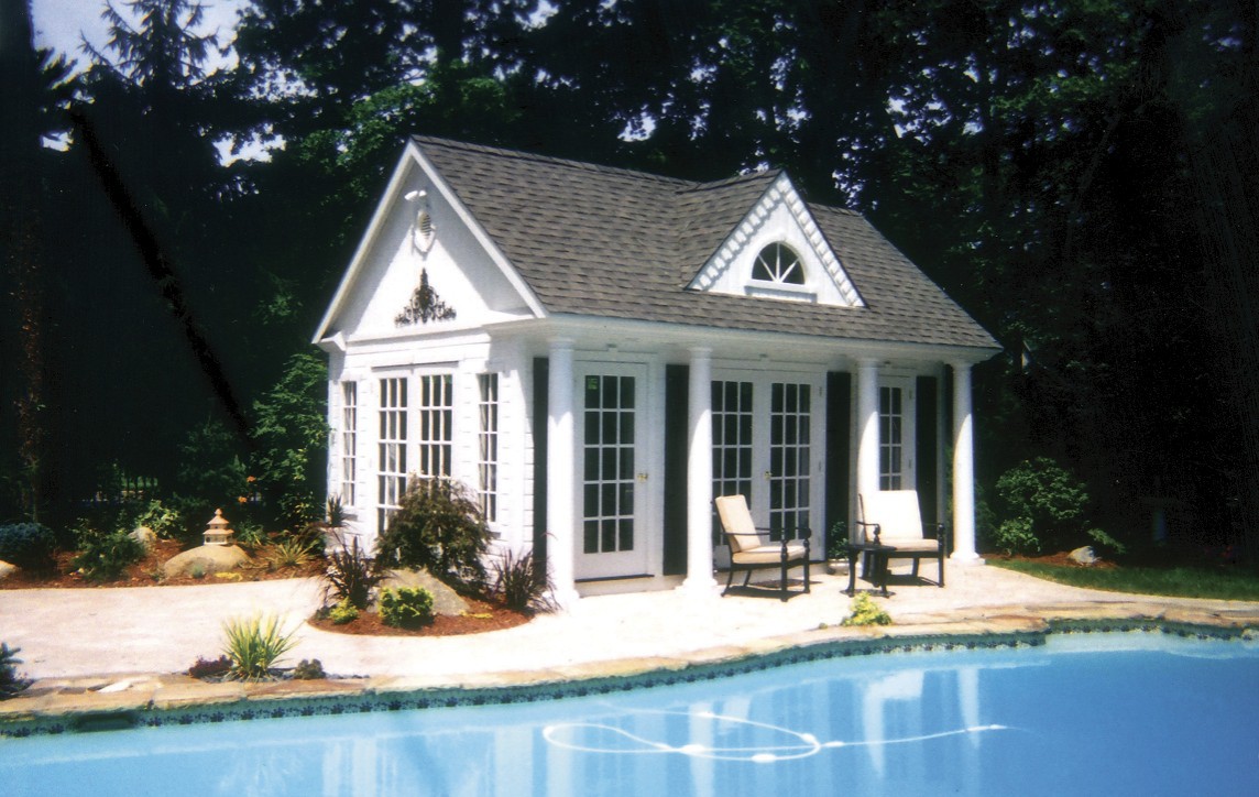 Windsor pool house design by a poolside with french doors all around seen from the left side. ID number 5550-2