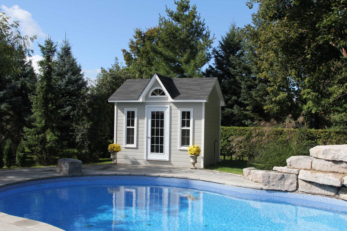 Canexel Copper Creek pool house design 9x12 with dormer beside a pool as seen from the right. ID number 3040-213.