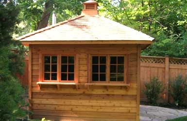Sonoma Garden shed plan 10x10 with rough cedar seen fron the back. ID number 4436-2