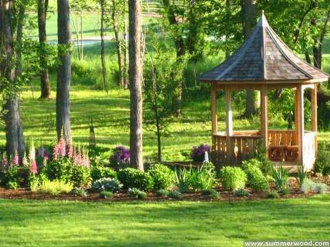 Tattle creek gazebo design 8' in garden with natural finish seen from left.ID number 2833-4.