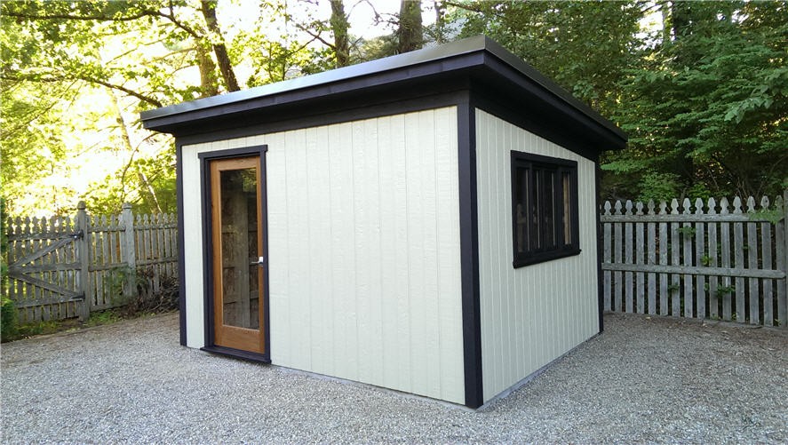 Canexel Urban studio shed plans 10x12  in a garden with a single french door . ID number-