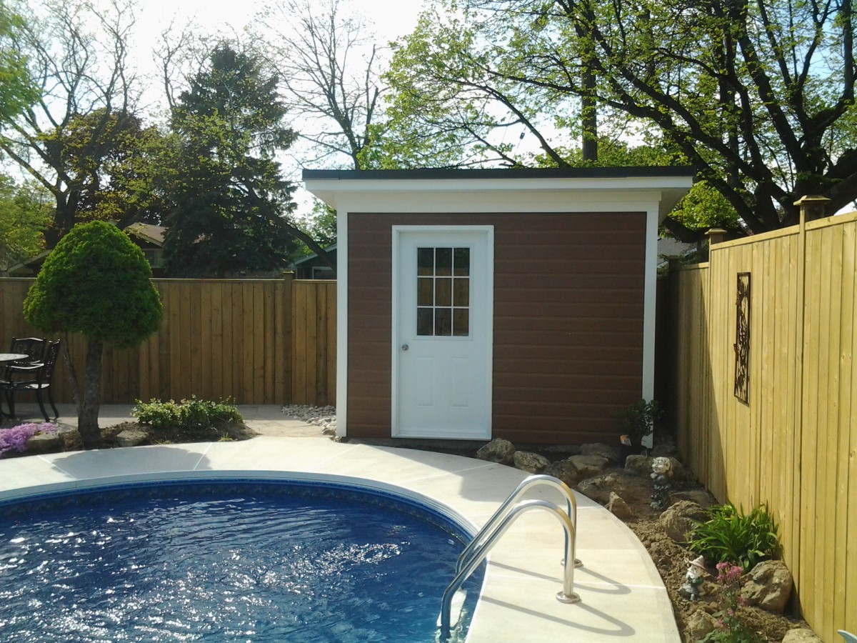 backyard urban studio pool house plan 8x10 with a white metal deluxe single door by a poolside. ID number 5635-2