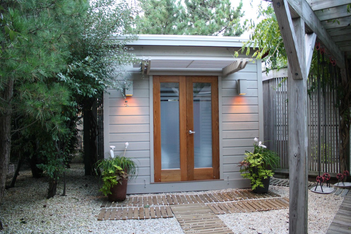 Cedar urban studio home studio design 8  x  10 in a backyard with double door seen from front.ID number 3438-4.