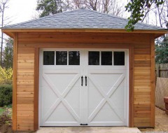 Archer garage plan 20 x 24 in driveway with metal doors seen from back.ID number 3351-2.