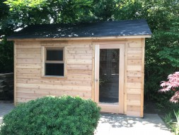 Cedar palmerston Shed design 7 x 14 in a backyard with concealed double doors from the front. ID number 5720.