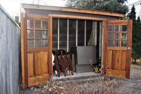 Canexel Sarawak Shed plan 5' x 10' in a backyard with 18 lite cedar double doors from the front. ID number 5742.