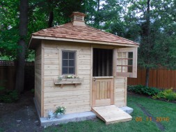Sonoma small garden shed plan 8x10 with a deluxe Dutch single door, one antique  flower box and cedar shingles. ID number