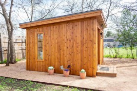 Cedar urban studio home studio design 12' x 14' in a backyard with French double doors as seen from the front. Id number 5750.