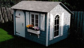 Bar harbor shed design 8 x 10 in a yard with pane arch seen from the right. ID number 1499
