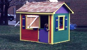 Cedar bear club kid playhouse plan 5x7 with playhouse window in the outdoor. ID number 3268-205.