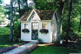 Copper creek shed design 8 x 12 with a French door in a garden seen from the right. ID number 2974-1.