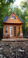 Cedar Balabunkie rustic cabin plan 10' x 10' facing ocean with French lite double doors as seen from the front. ID number 5724-1