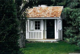 Cedar Peach Pickers Porch playhouse plan 7x7 with flower box in the garden. ID number 2801-206.