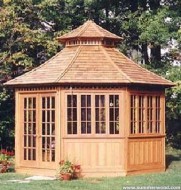 San cristobal gazebo design 14' in backyard with stained finish seen from front.ID number 3418-1.