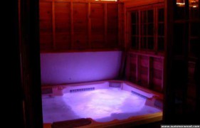 Sojo hot tub enclosure plan 10  x  12 in yard with window screens seen from front.ID number 3343-8.