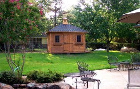 Sonoma shed plan 10x12 with smooth cedar siding  in a backyard seen from the left. ID number 4467-1