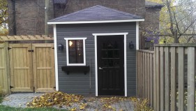 Canexel sonoma shed design 9 x 12 with a stark colour in a backyard seen from the side. ID number 3276-1.