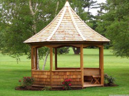 Tattle Creek gazebo design 12ft with gazebo benching in the park as seen from the left. ID number 3140-161.