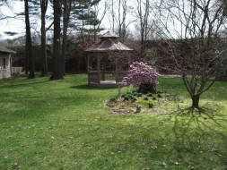 Victorian gazebo design 10' in a garden seen from the front. ID number 4299-1