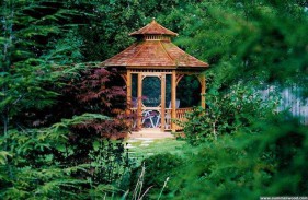 Victorian gazebo plan 12' in garden with stained finish seen from front.ID number 3444-1.