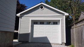 Backyard Canexel Highlands Garage Plan 14' x 24' with steel insulated garage door in the front. ID number 5730-1.