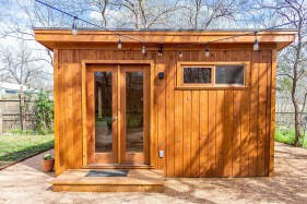 Cedar urban studio home studio design 12' x 14' in a backyard with French double doors as seen from the front. Id number 5750.
