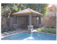 Montpellier gazebo plan 12  x  12 beside pool with pavilion upright brackets seen from right.ID number 3408-2.