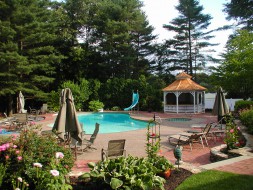 Victorian gazebo design 14ft by a poolside with cedar shingles seen fron the front. ID number