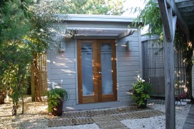 Cedar urban studio home studio design 8  x  10 in a backyard with double door seen from front.ID number 3438-3.